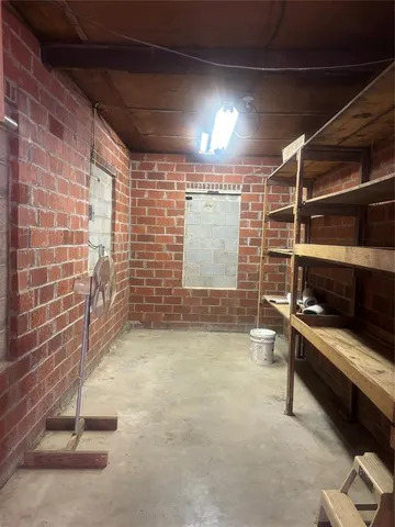 a view of an empty room with windows