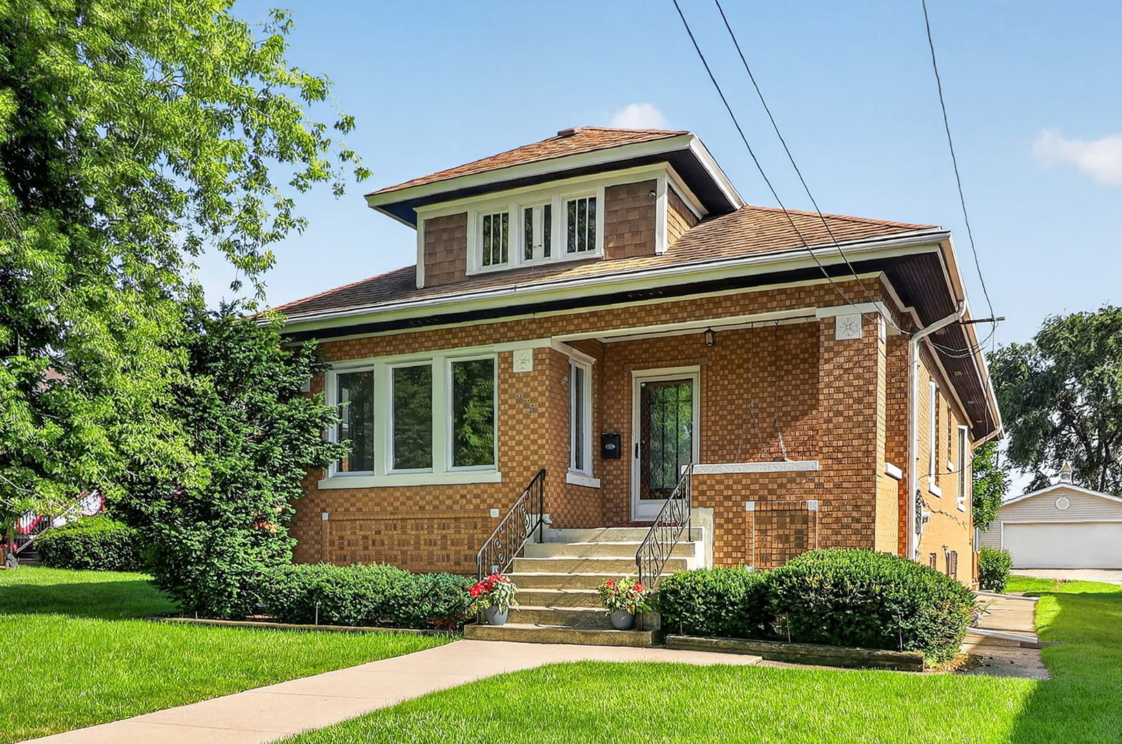 708 McCarthy Road Lemont, IL 60439 - Photo 1 of 14 a front view of a house with a yard