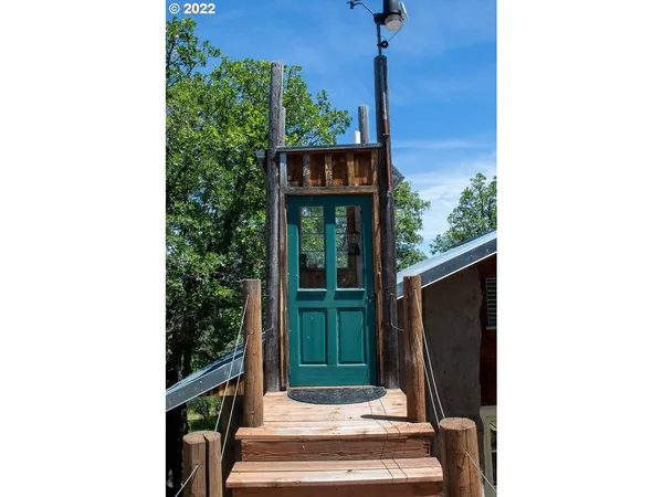 a swimming pool with trees in the background