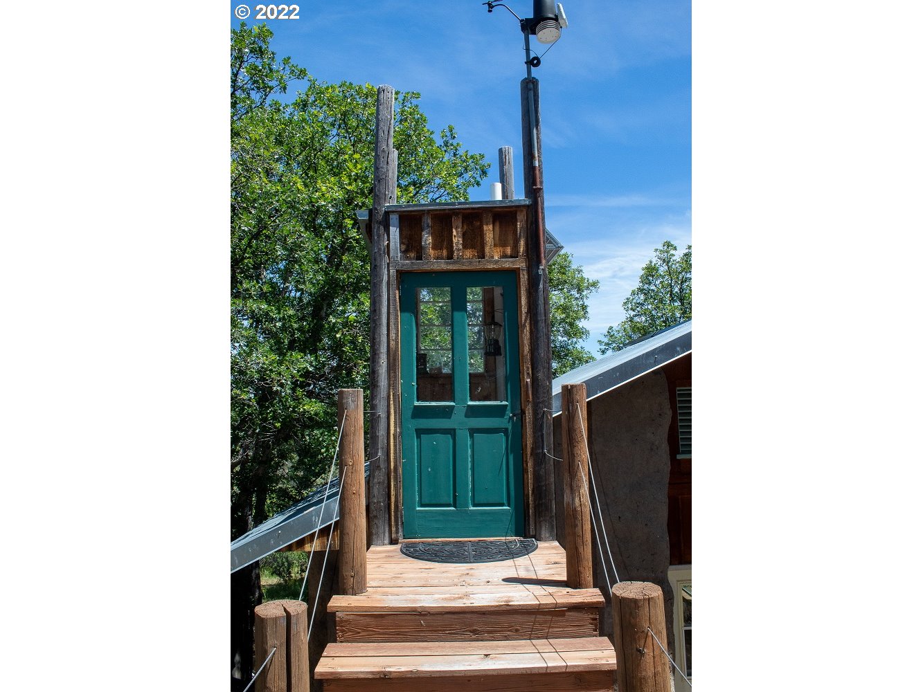 10000 Copco Road Ashland, OR 97520 - Photo 22 of 32 a front view of a house with a porch
