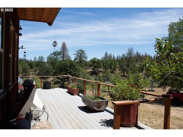 a front view of a house with table and chairs