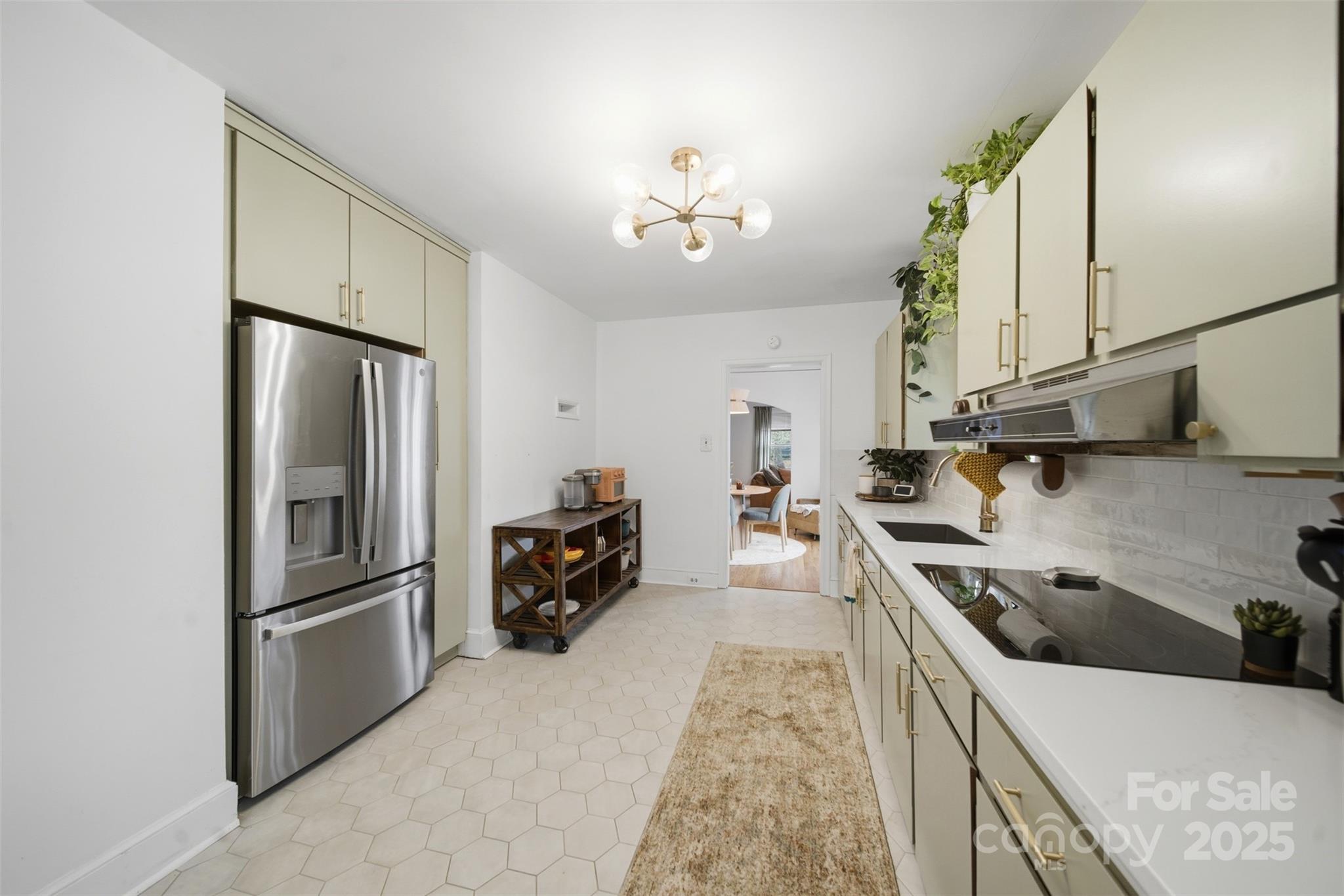 441 Jackson Street Rock Hill, SC 29730 - Photo 14 of 30 a kitchen with stainless steel appliances granite countertop a refrigerator a sink dishwasher a stove with white cabinets and wooden floor