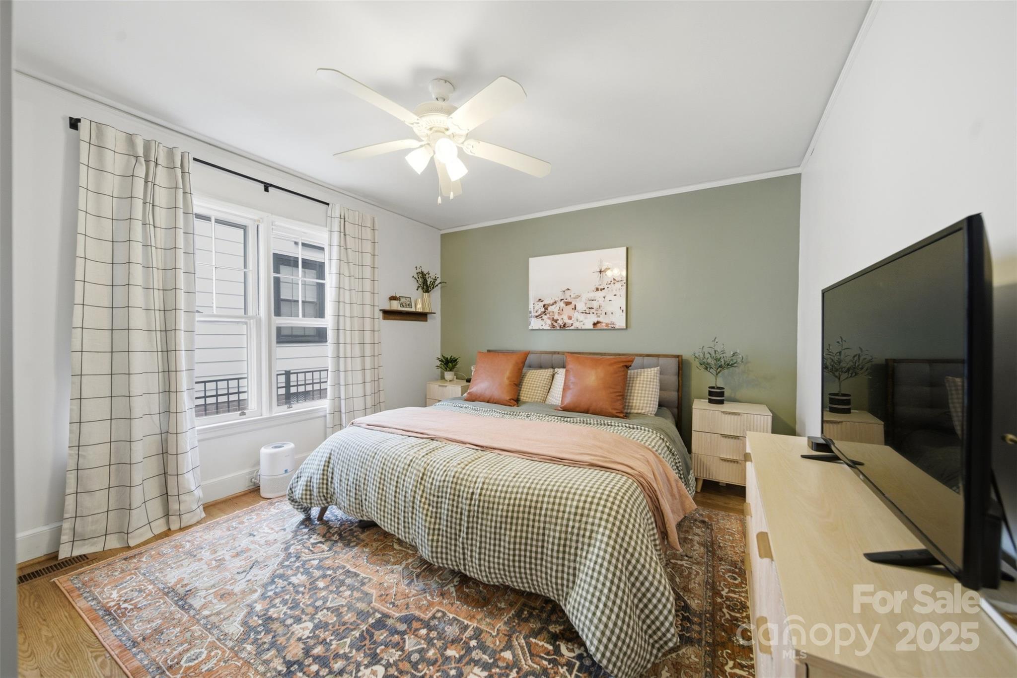 441 Jackson Street Rock Hill, SC 29730 - Photo 21 of 30 a bedroom with a large bed and a flat screen tv