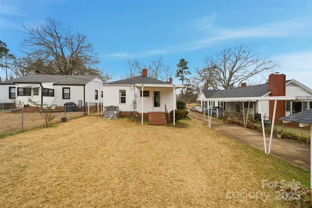 a view of a house with swimming pool and porch