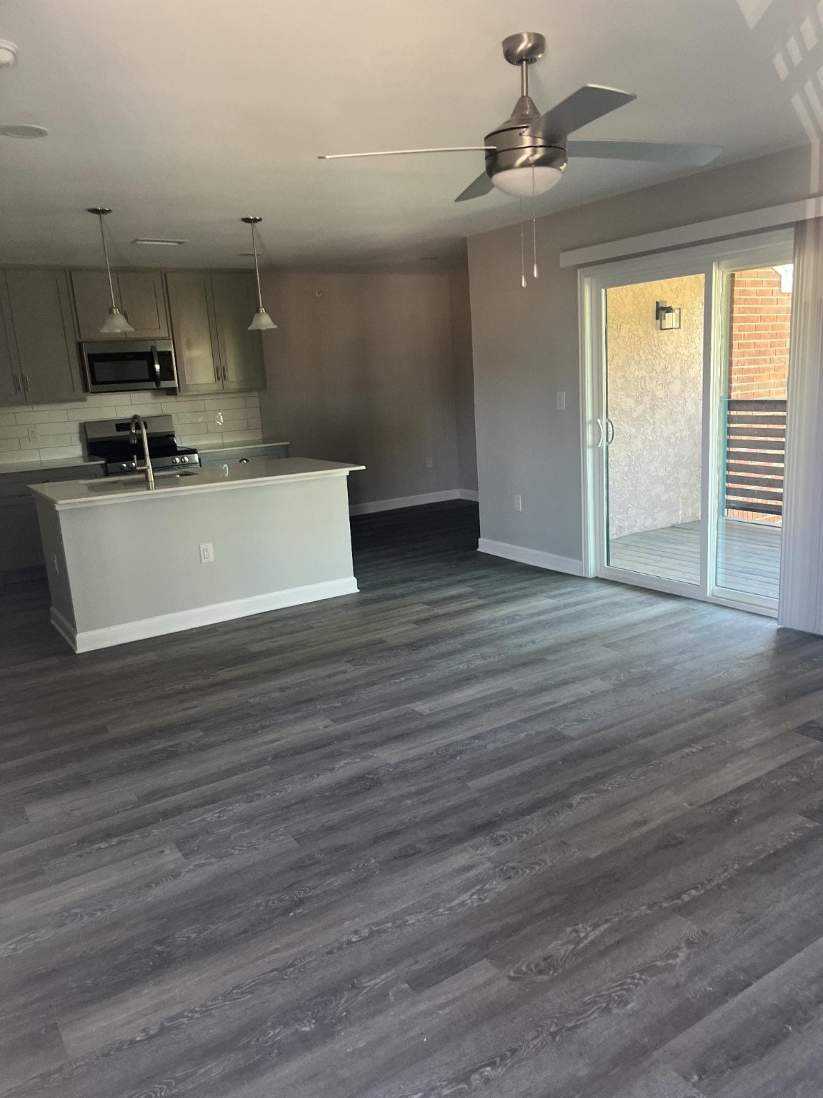 1500 South Jupiter Road, Unit 512 Allen, TX 75002 - Photo 2 of 7 a view of kitchen with stainless steel appliances wooden floor large window and wooden floor