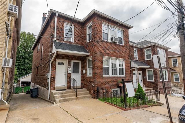 1209 88th Street, Unit 2 North Bergen, NJ 07047 - Photo 1 of 1 a front view of a house