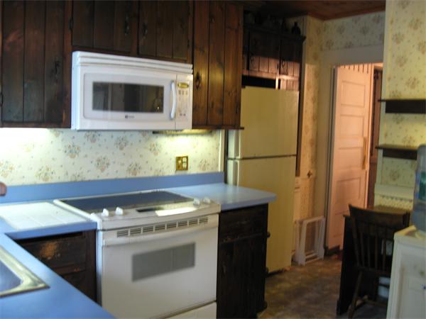 288 Sterling Road Princeton, MA 01541 - Photo 8 of 14 a kitchen with stainless steel appliances granite countertop a stove a microwave and a refrigerator