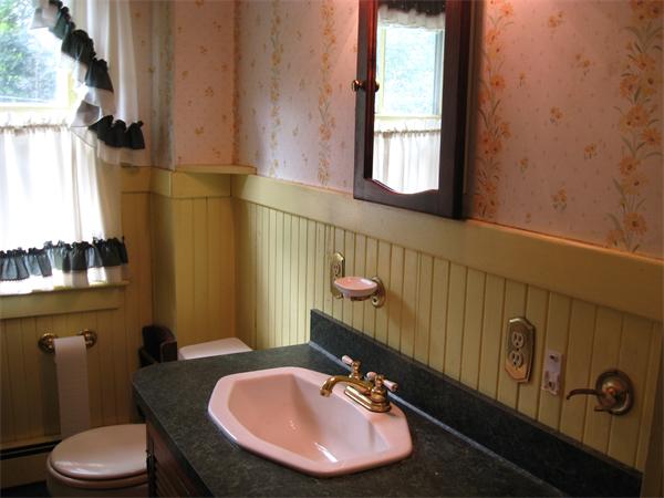 288 Sterling Road Princeton, MA 01541 - Photo 9 of 14 a bathroom with a sink mirror and toilet