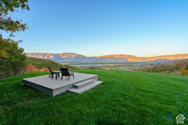 5878 Snowbasin Road Huntsville, UT 84317 - Photo 57 of 90 Expansive green lawn with a composite deck and two steps