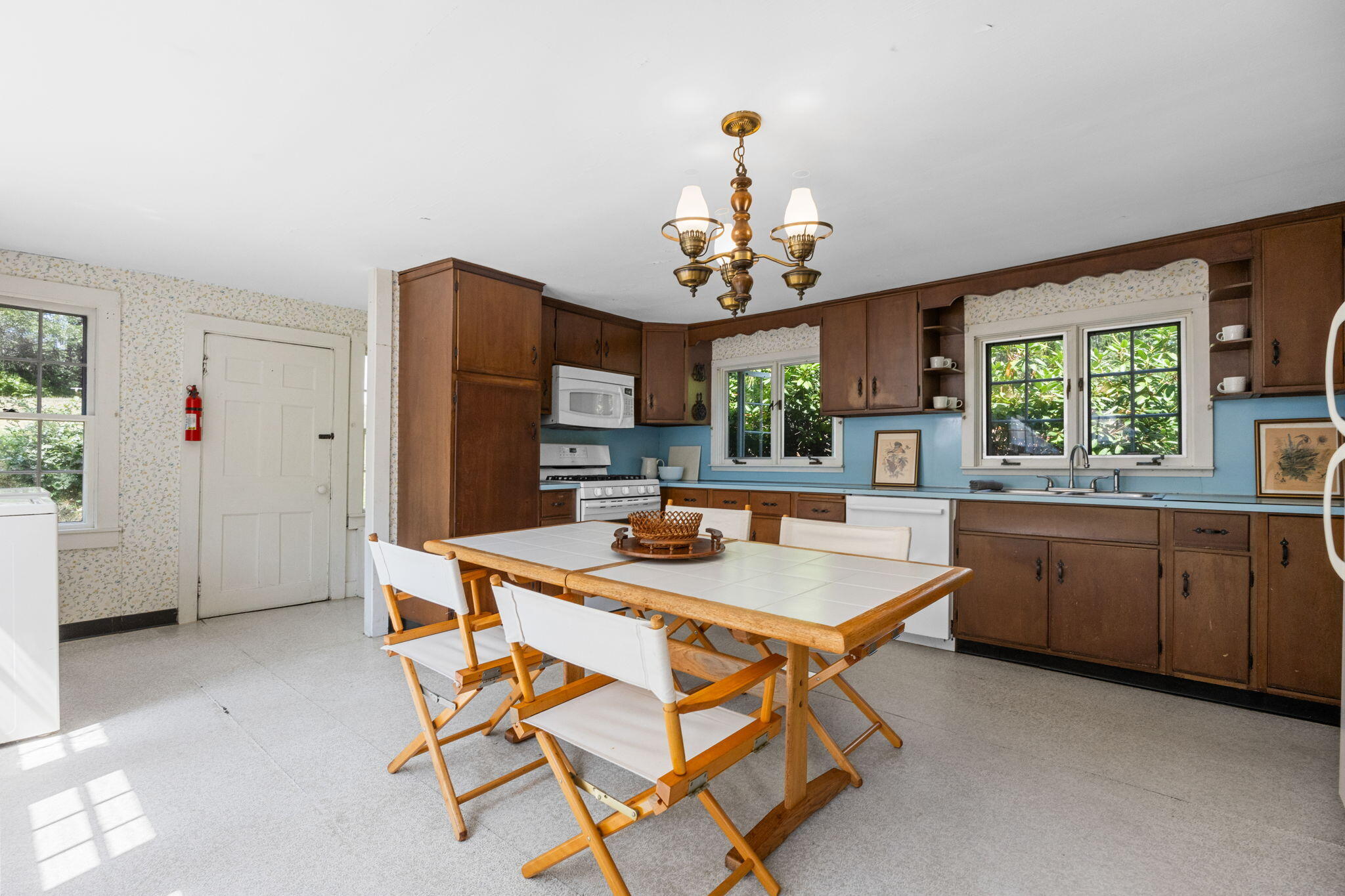 34 Truro Center Road Truro, MA 02666 - Photo 18 of 43 a dining room with a table chairs and kitchen view
