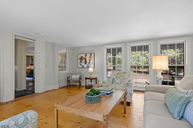 a living room with furniture and a table
