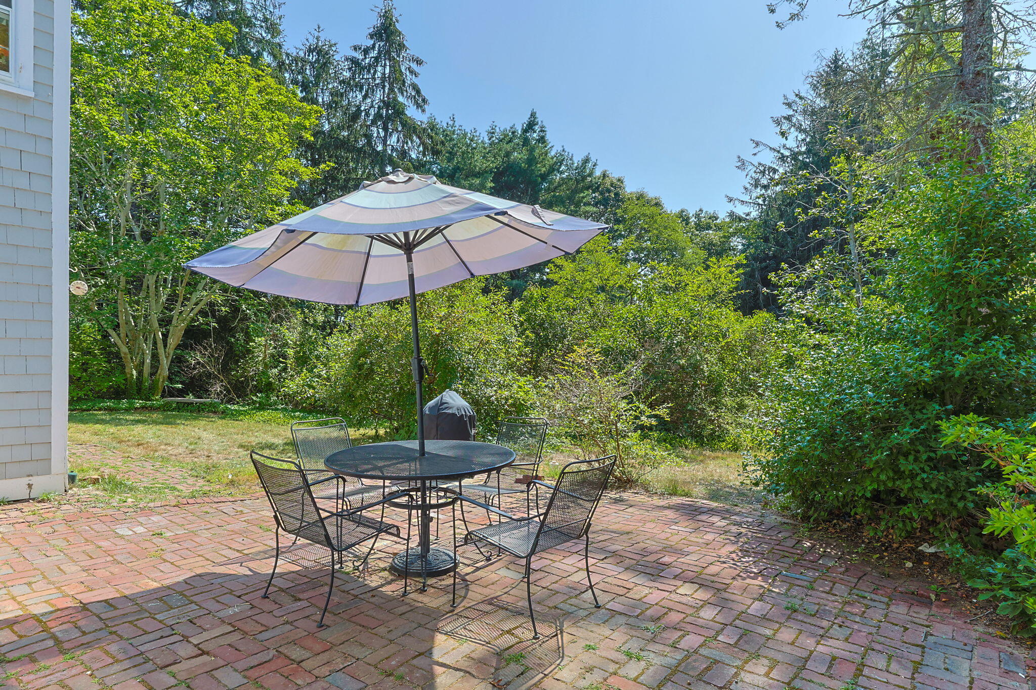 34 Truro Center Road Truro, MA 02666 - Photo 40 of 43 a view of backyard with seating space and trees