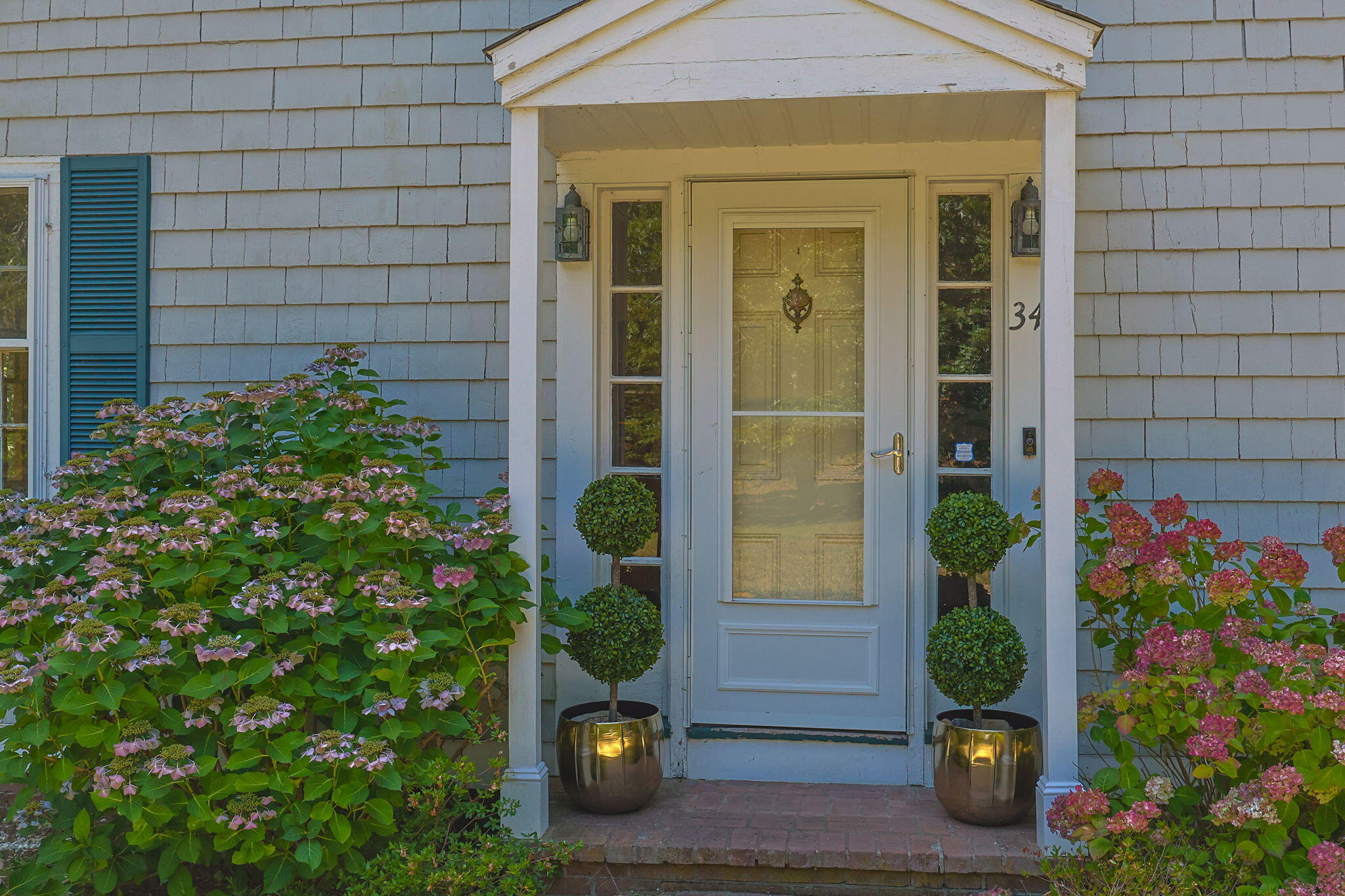 34 Truro Center Road Truro, MA 02666 - Photo 6 of 43 front view of a house with a potted plant