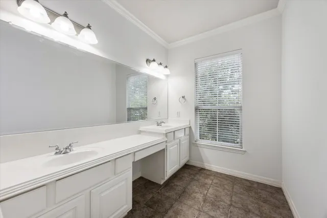 a bathroom with a sink double vanity and a shower