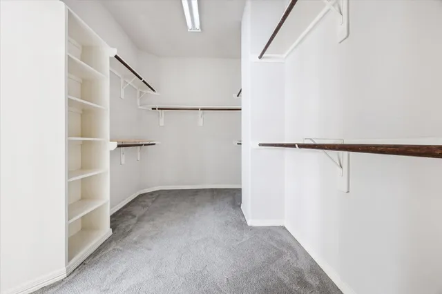 a view of an empty walk in closet