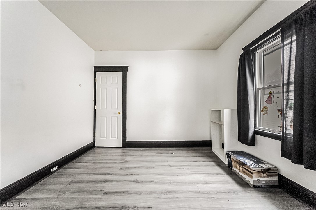 2014 Cook Avenue Cleveland, OH 44109 - Photo 14 of 37 Unfurnished room with light hardwood / wood-style flooring