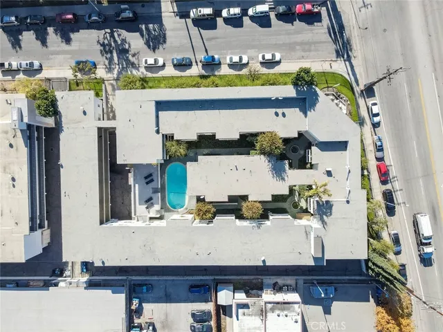 an aerial view of houses with outdoor space