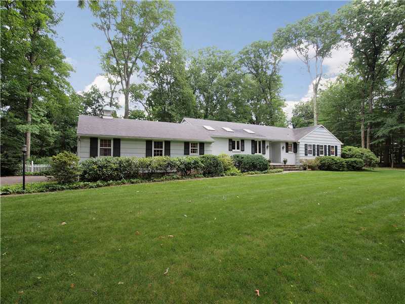 2 Shady Acres Road Darien, CT 06820 - Photo 1 of 18 a front view of a house with a yard