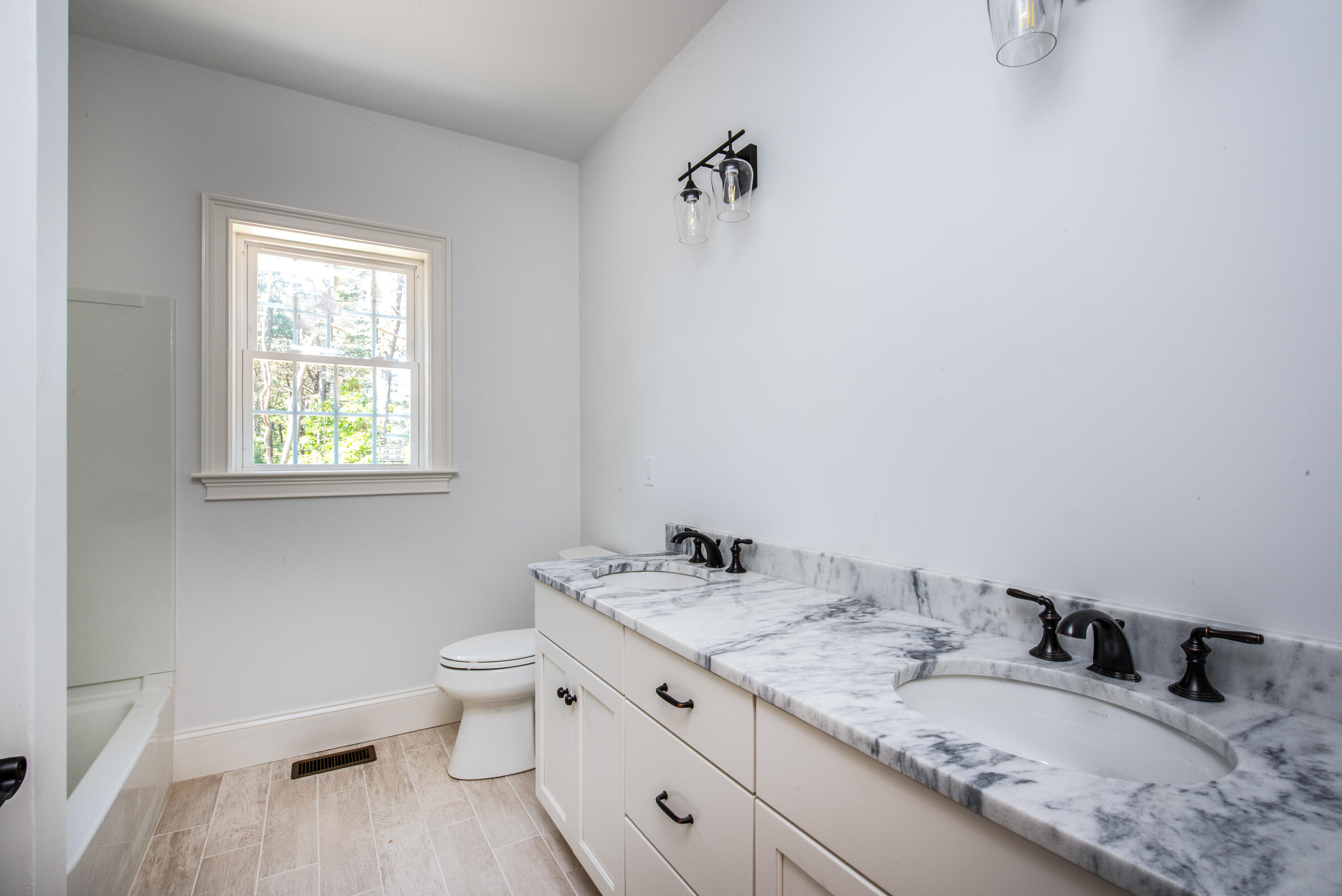 36 Sam Hollow Road Wellfleet, MA 02667 - Photo 13 of 43 a bathroom with a granite countertop sink toilet and mirror