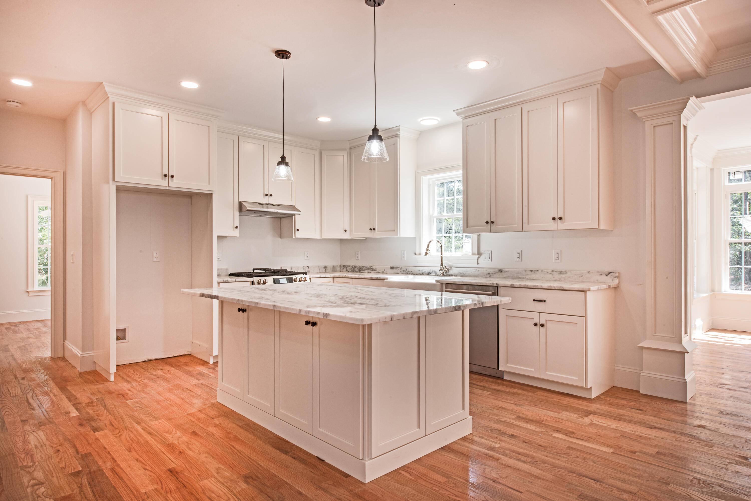 36 Sam Hollow Road Wellfleet, MA 02667 - Photo 2 of 43 a kitchen with a white stove cabinets and wooden floor