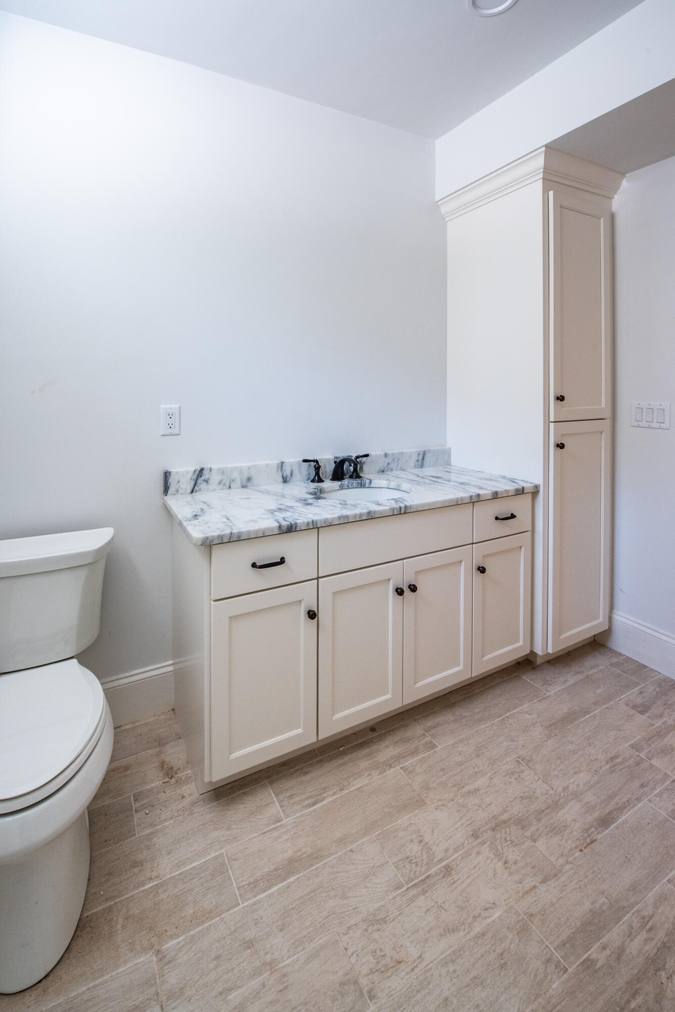 36 Sam Hollow Road Wellfleet, MA 02667 - Photo 22 of 43 a spacious bathroom with a granite countertop toilet and a sink