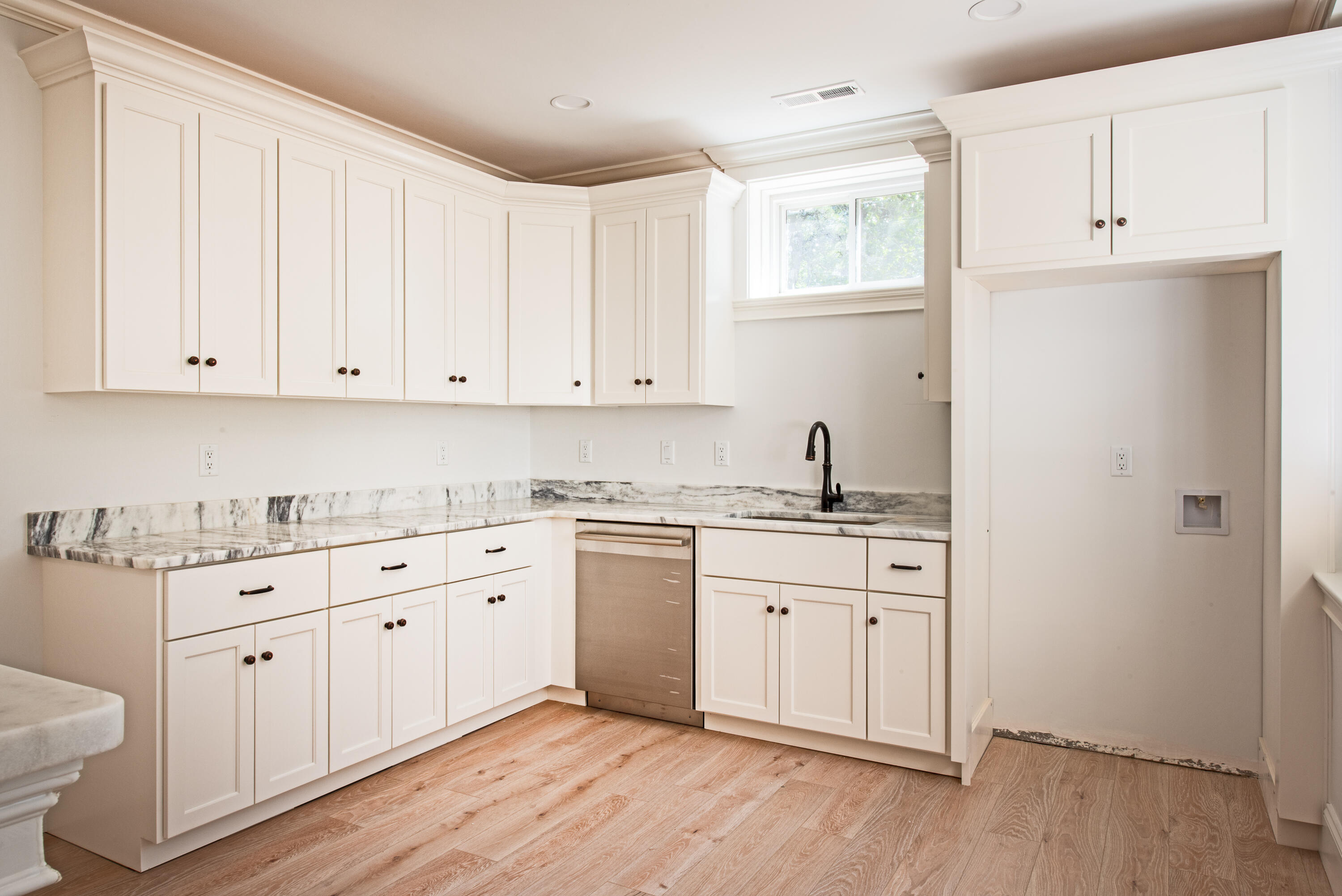 36 Sam Hollow Road Wellfleet, MA 02667 - Photo 26 of 43 a kitchen with granite countertop white cabinets and white appliances