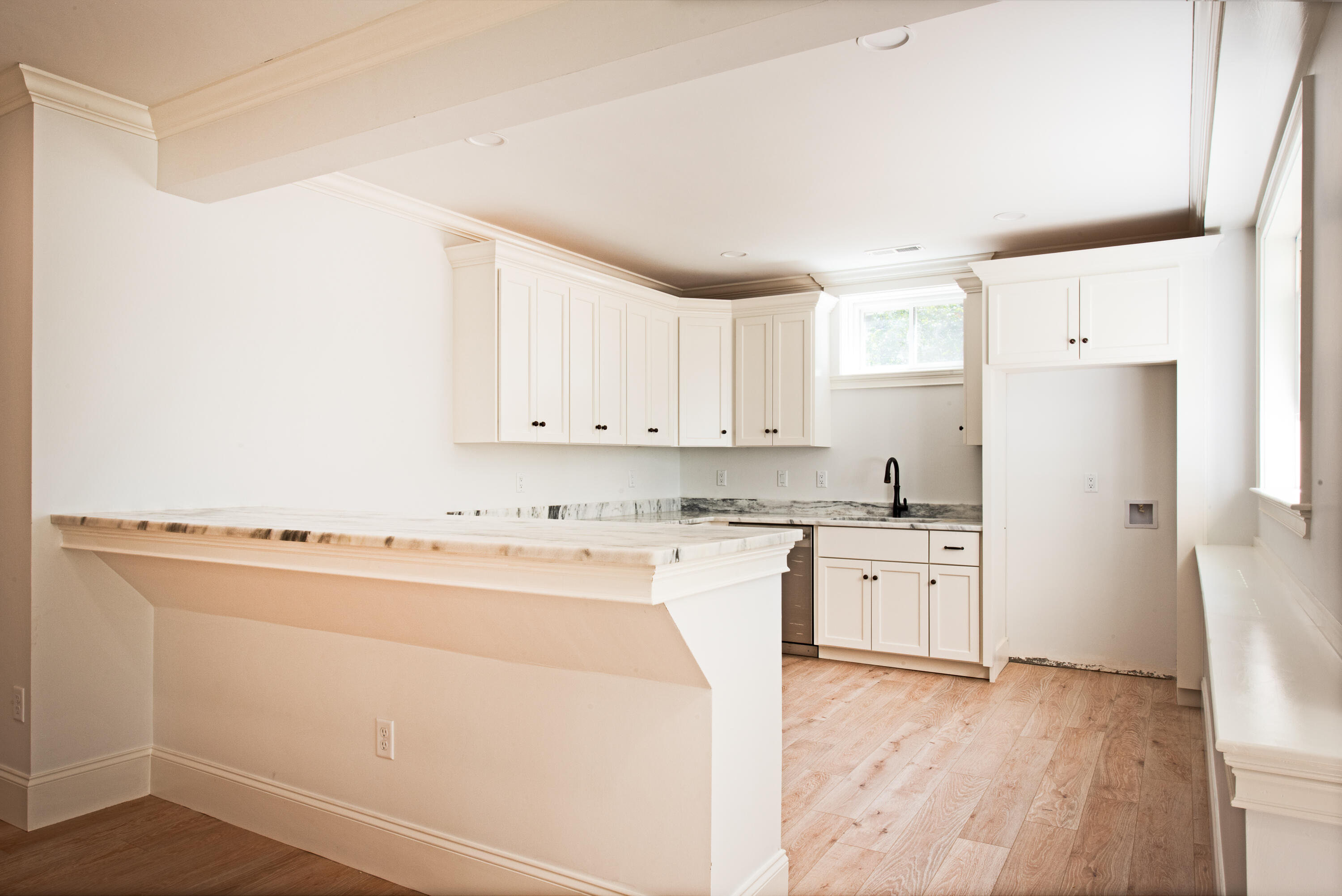 36 Sam Hollow Road Wellfleet, MA 02667 - Photo 27 of 43 a kitchen with granite countertop cabinets and white appliances
