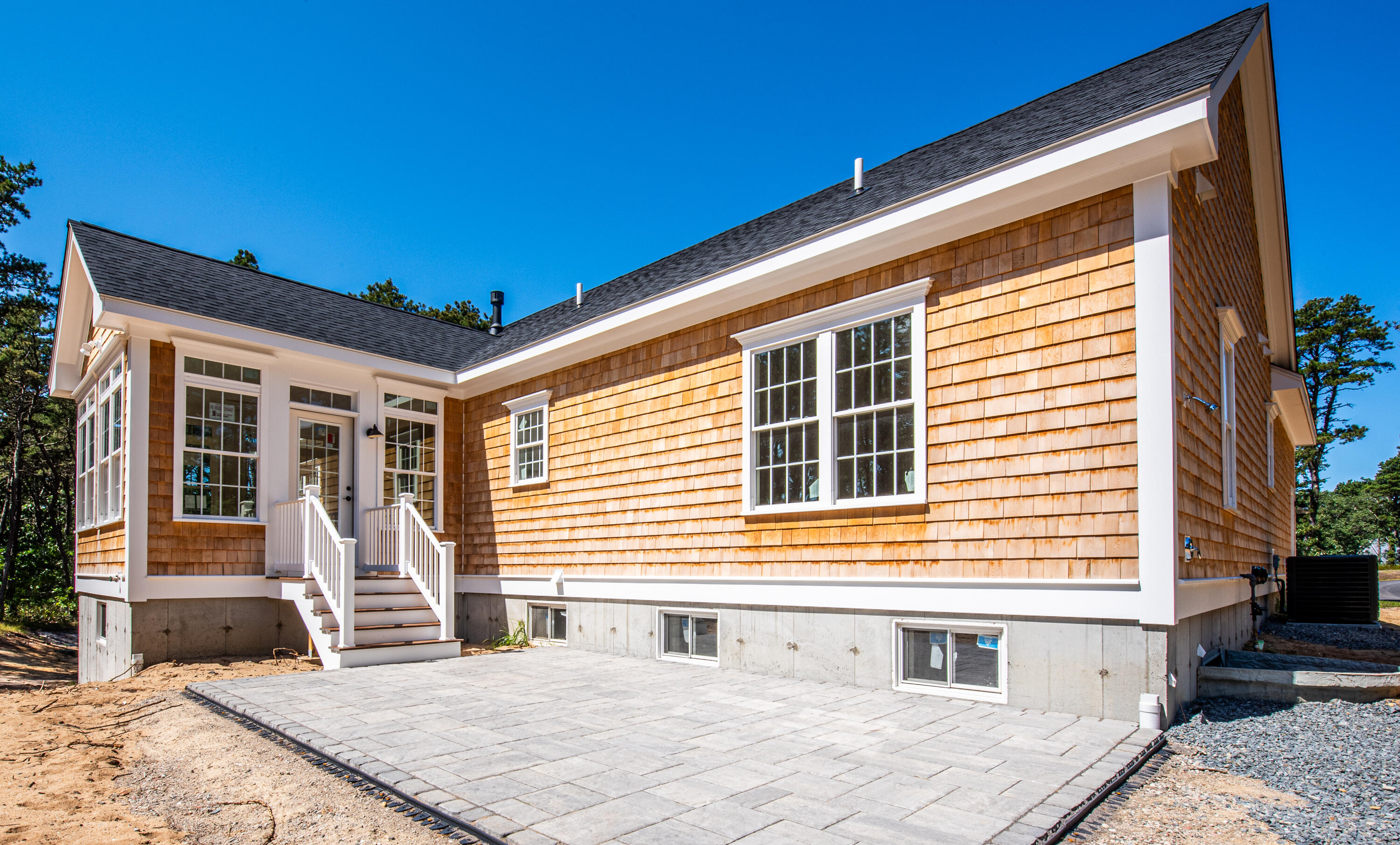 36 Sam Hollow Road Wellfleet, MA 02667 - Photo 29 of 43 a front view of a house with a yard