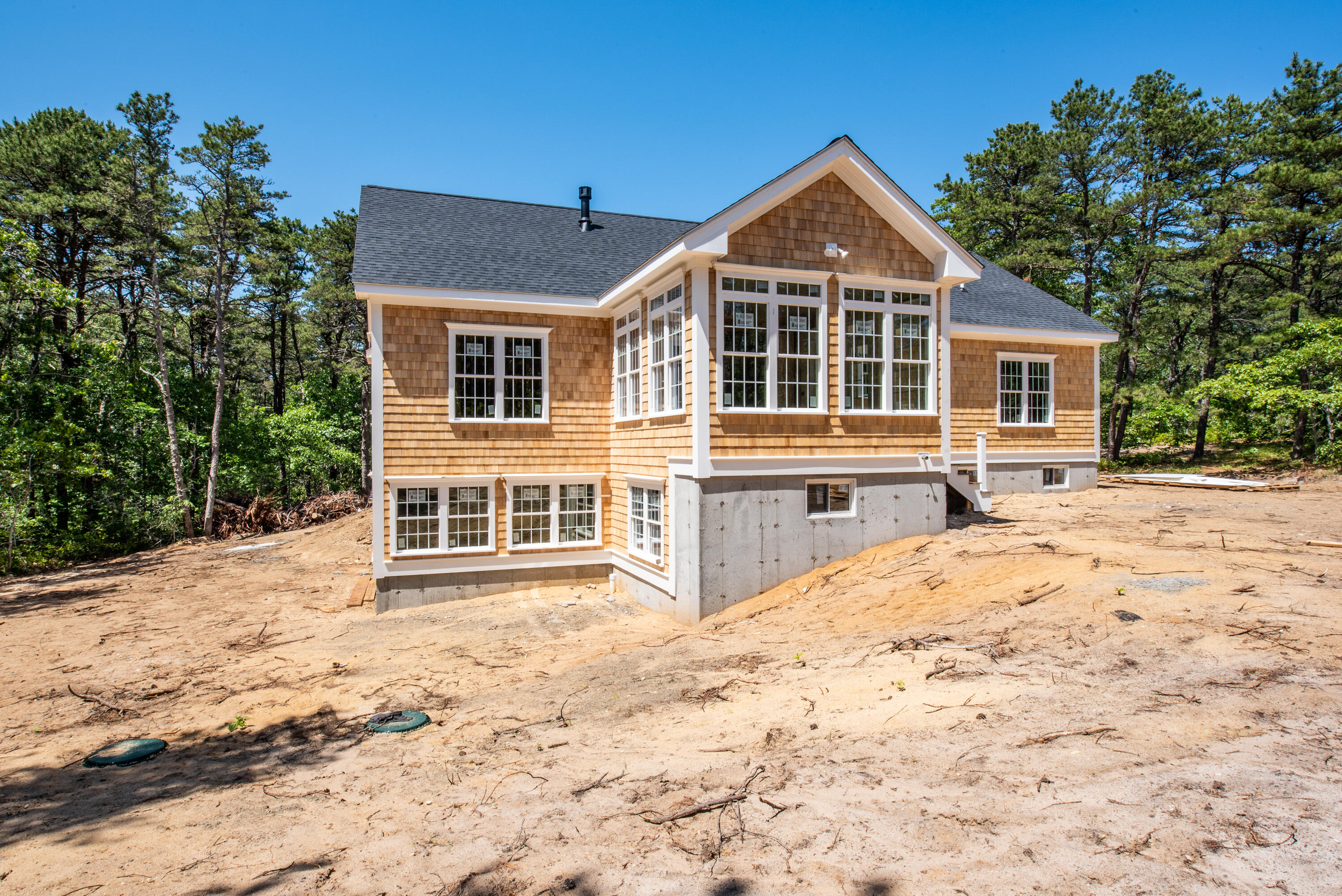 36 Sam Hollow Road Wellfleet, MA 02667 - Photo 33 of 43 a front view of a house with a yard