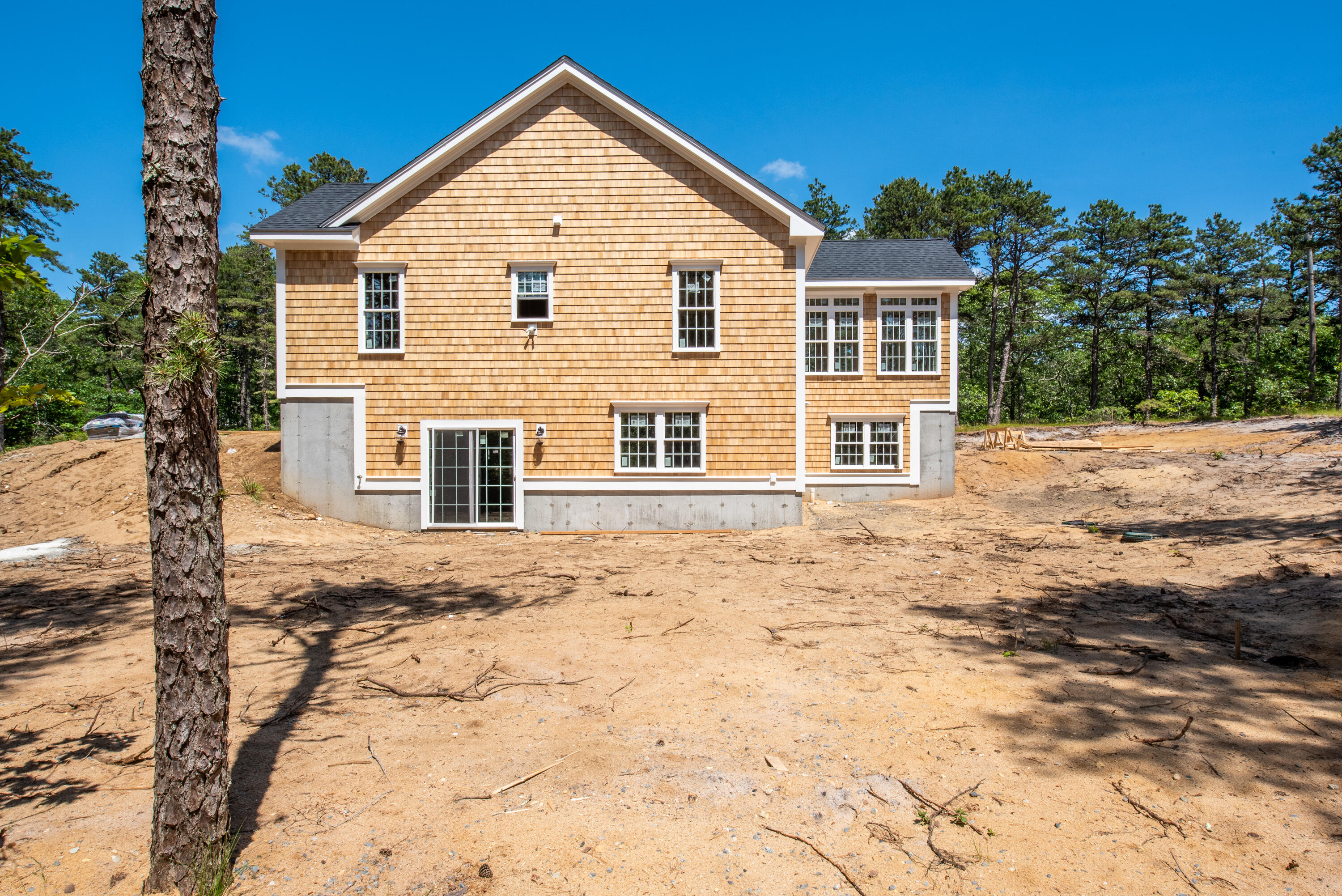 36 Sam Hollow Road Wellfleet, MA 02667 - Photo 34 of 43 a view of a house with a yard