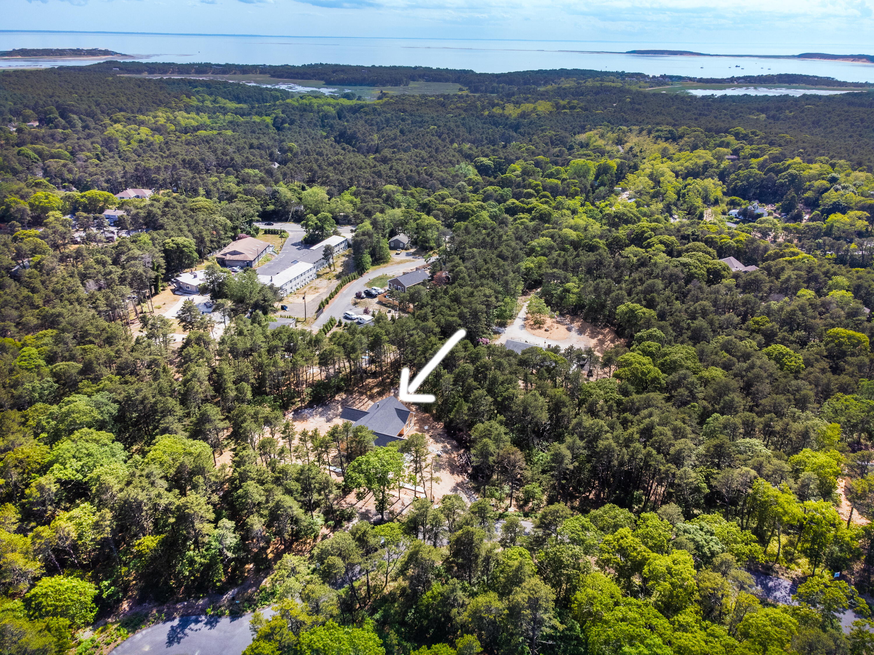 36 Sam Hollow Road Wellfleet, MA 02667 - Photo 39 of 43 a view of a houses with a yard