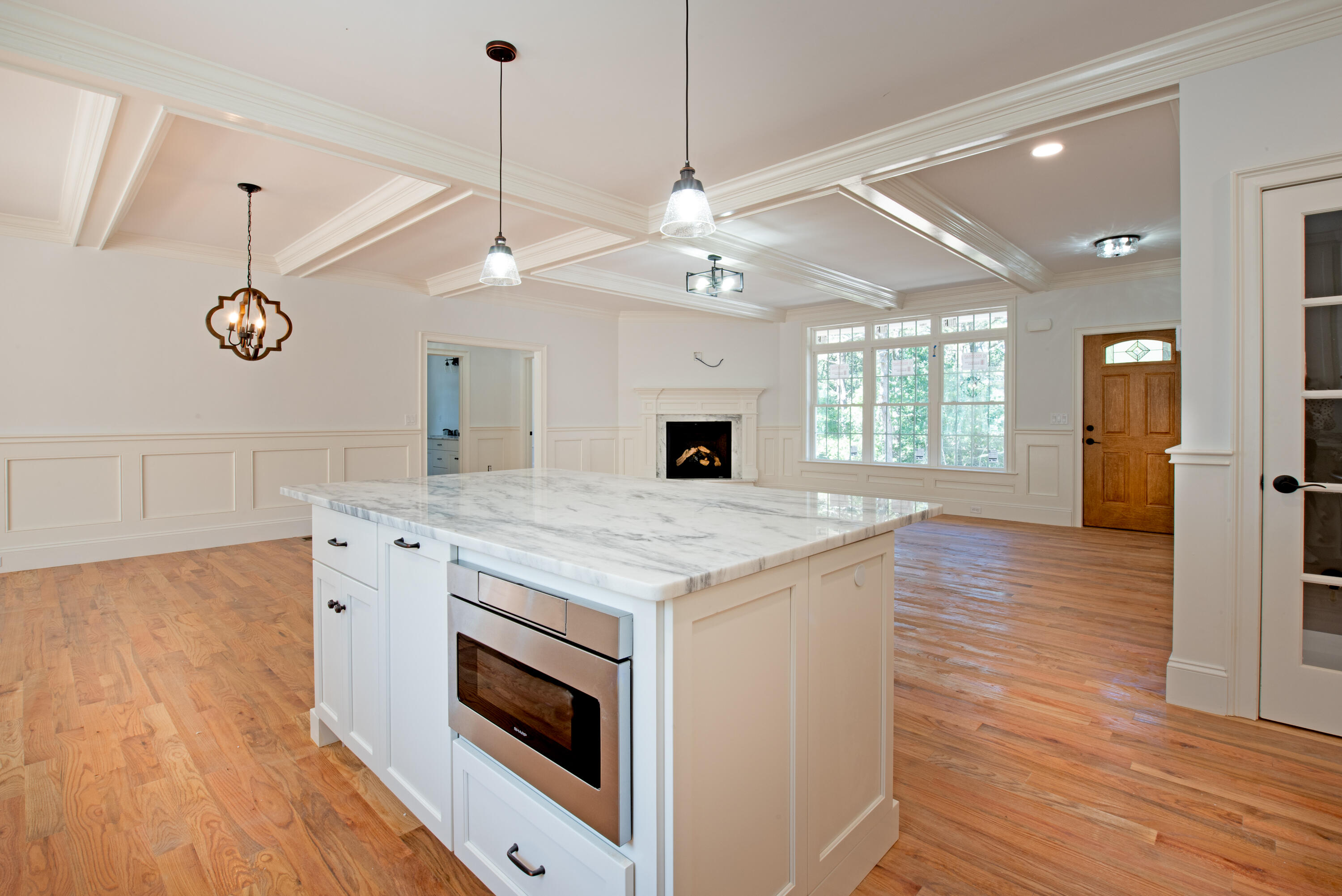 36 Sam Hollow Road Wellfleet, MA 02667 - Photo 4 of 43 a open kitchen with a stove oven and a wooden floor
