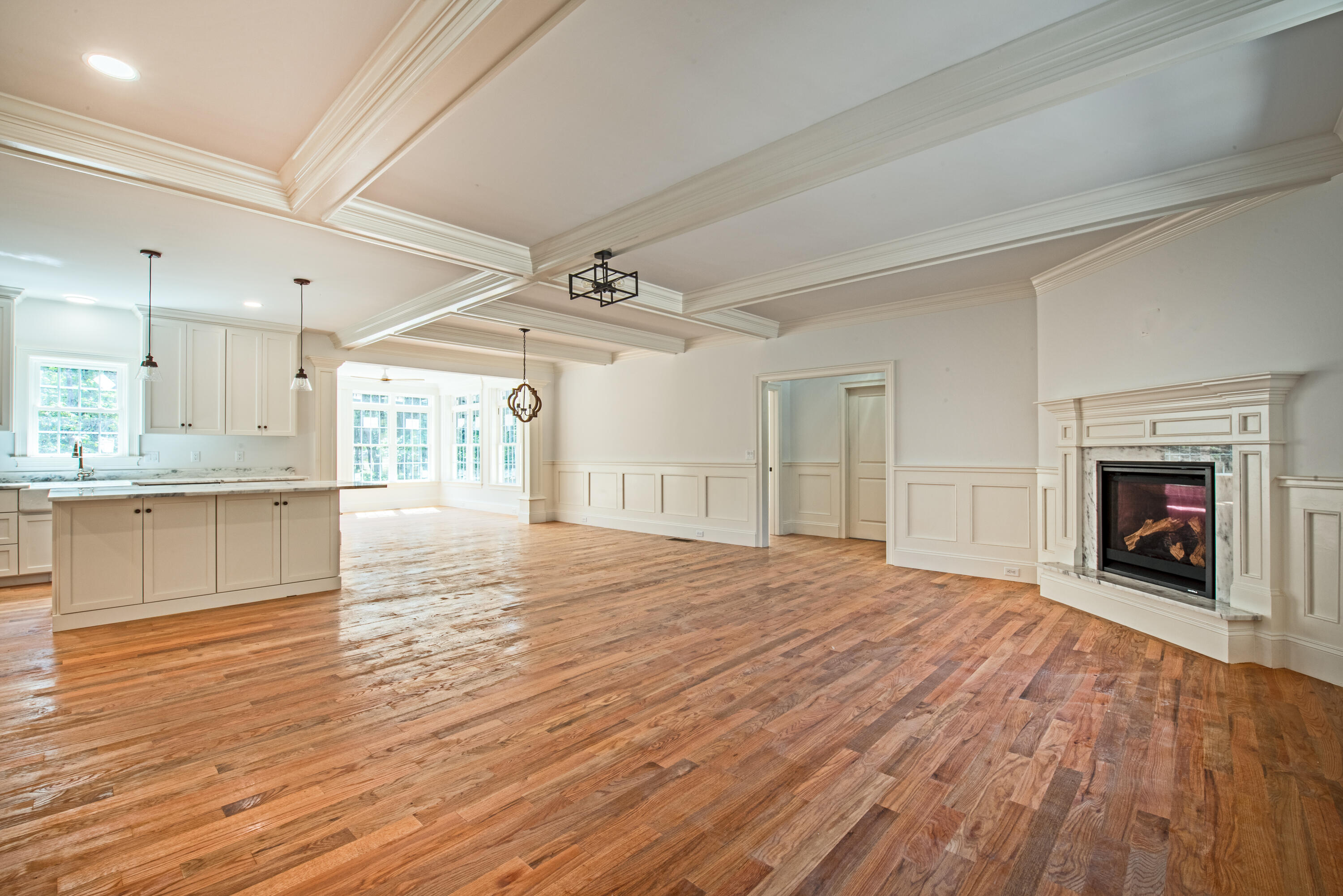 36 Sam Hollow Road Wellfleet, MA 02667 - Photo 7 of 43 a view of an empty room with wooden floor fireplace and a window