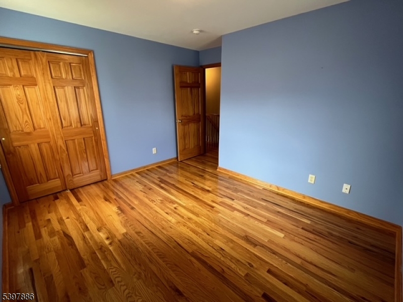 502 Summit Avenue, Unit 1 Westfield, NJ 07090 - Photo 11 of 19 a view of empty room with wooden floor and fan
