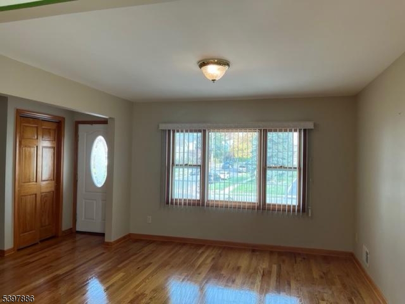 502 Summit Avenue, Unit 1 Westfield, NJ 07090 - Photo 2 of 19 an empty room with wooden floor and windows