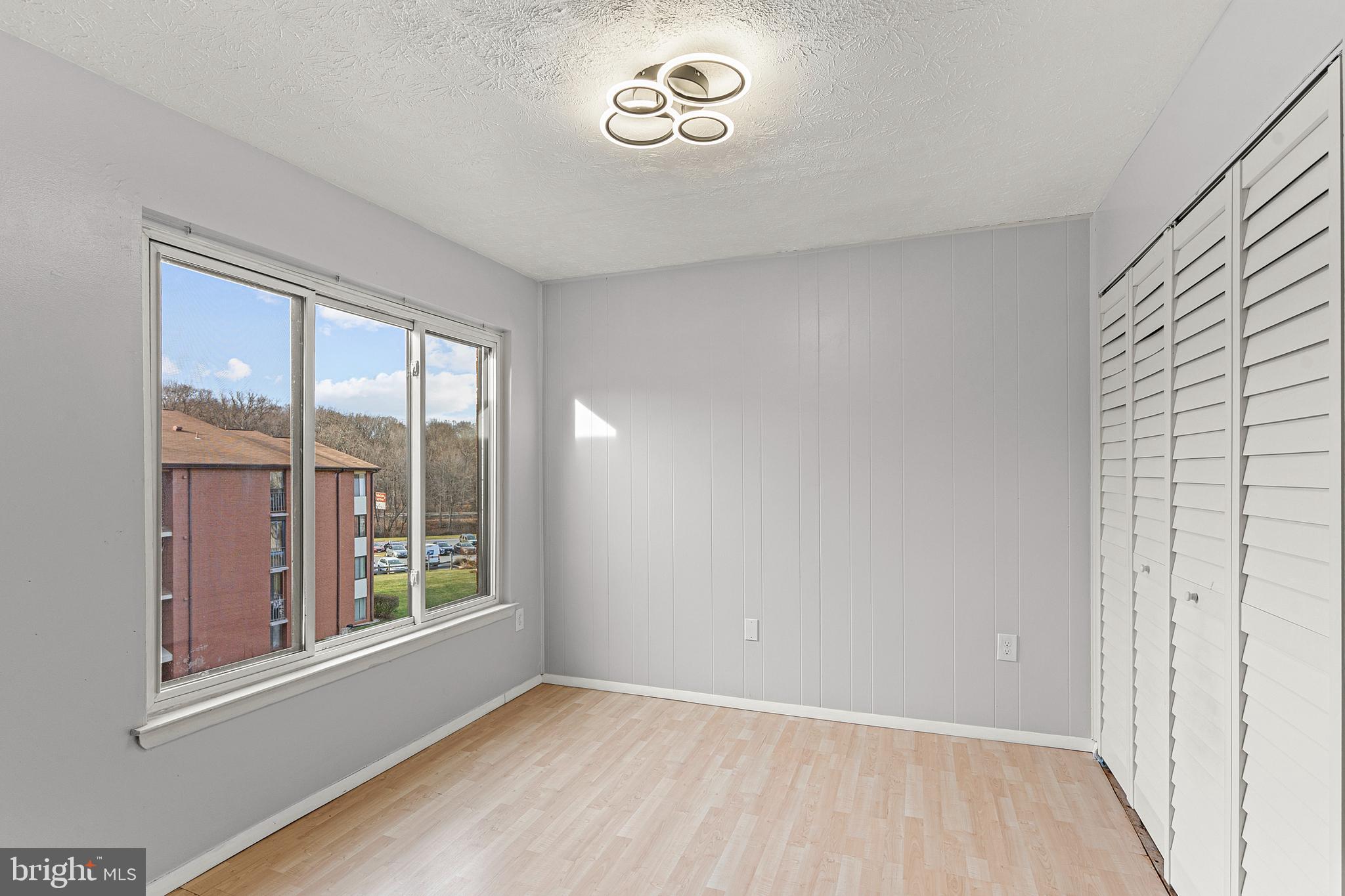 8005 Mandan Road, Unit 302 Greenbelt, MD 20770 - Photo 13 of 22 an empty room with a window
