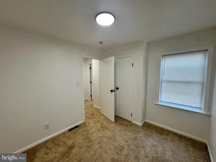 an empty room with windows and window