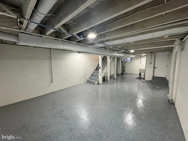 a swimming pool view with a seating space