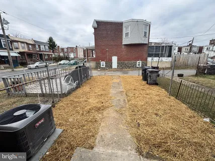 a view of a building with snow on the road