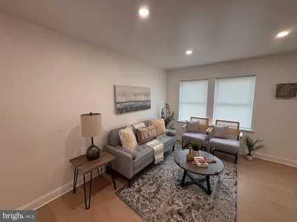 a living room with furniture and a rug