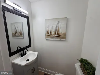 a bathroom with a sink and mirror