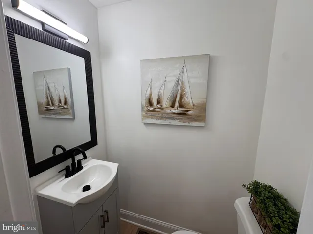 a bathroom with a sink and mirror