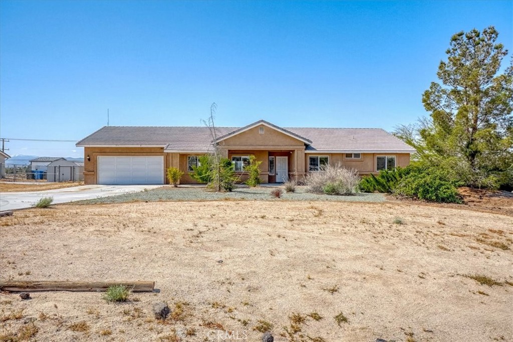 17819 Quantico Road Apple Valley, CA 92307 - Photo 1 of 1 a front view of a house with a yard