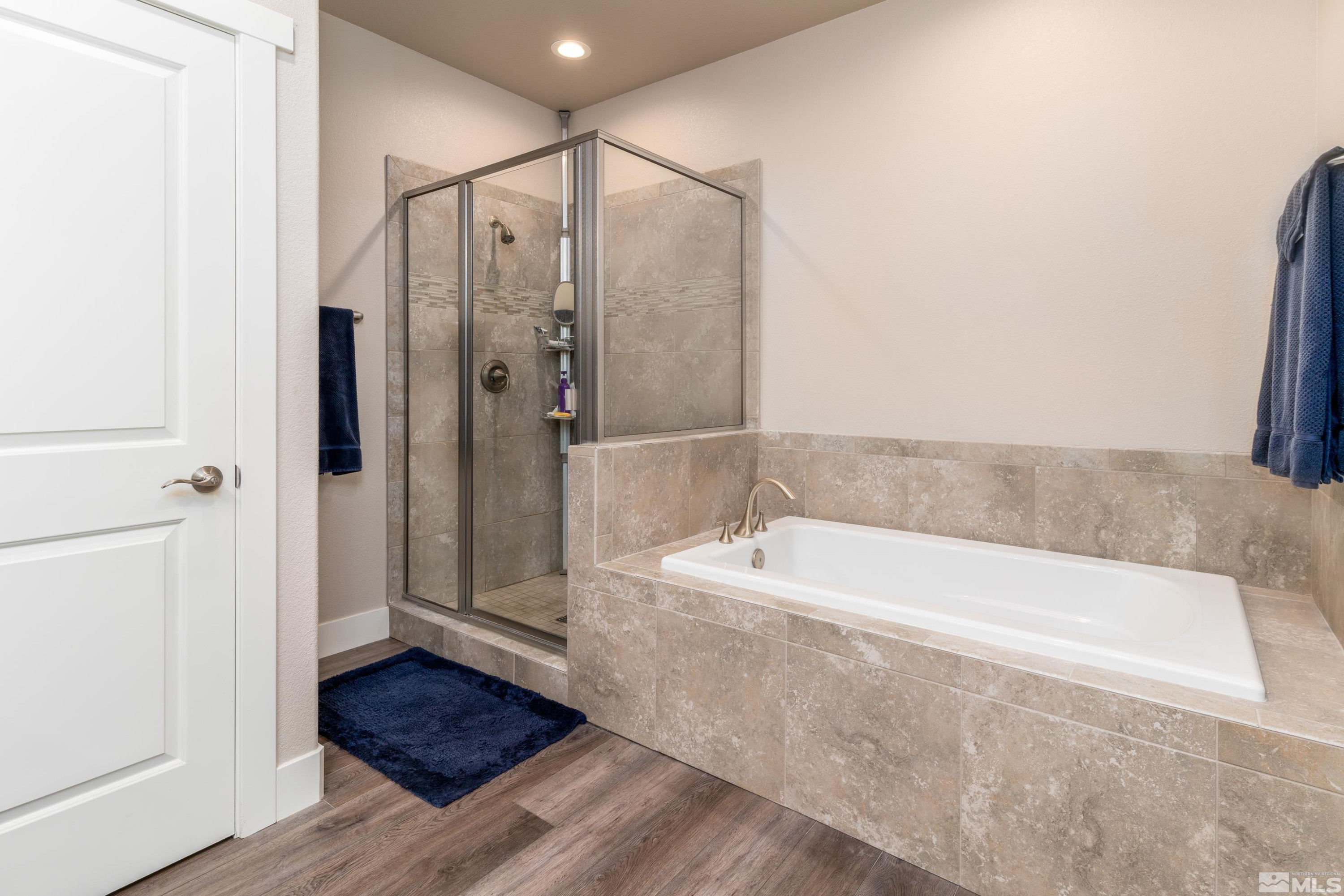 1230 West Cottage Loop Gardnerville, NV 89460 - Photo 13 of 25 a bathroom with a tub shower and sink