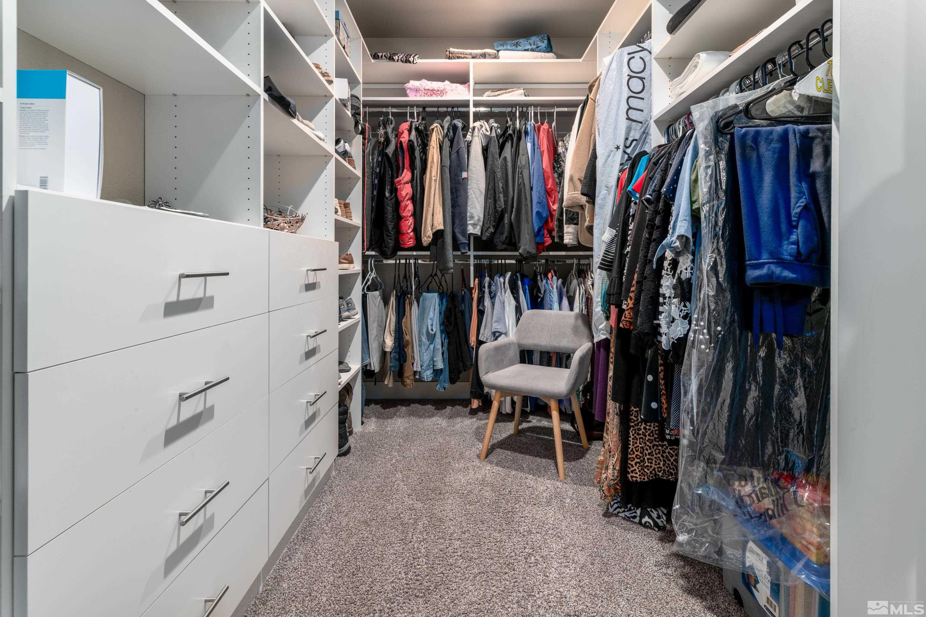 1230 West Cottage Loop Gardnerville, NV 89460 - Photo 15 of 25 a view of walk in closet with clothes and shoes