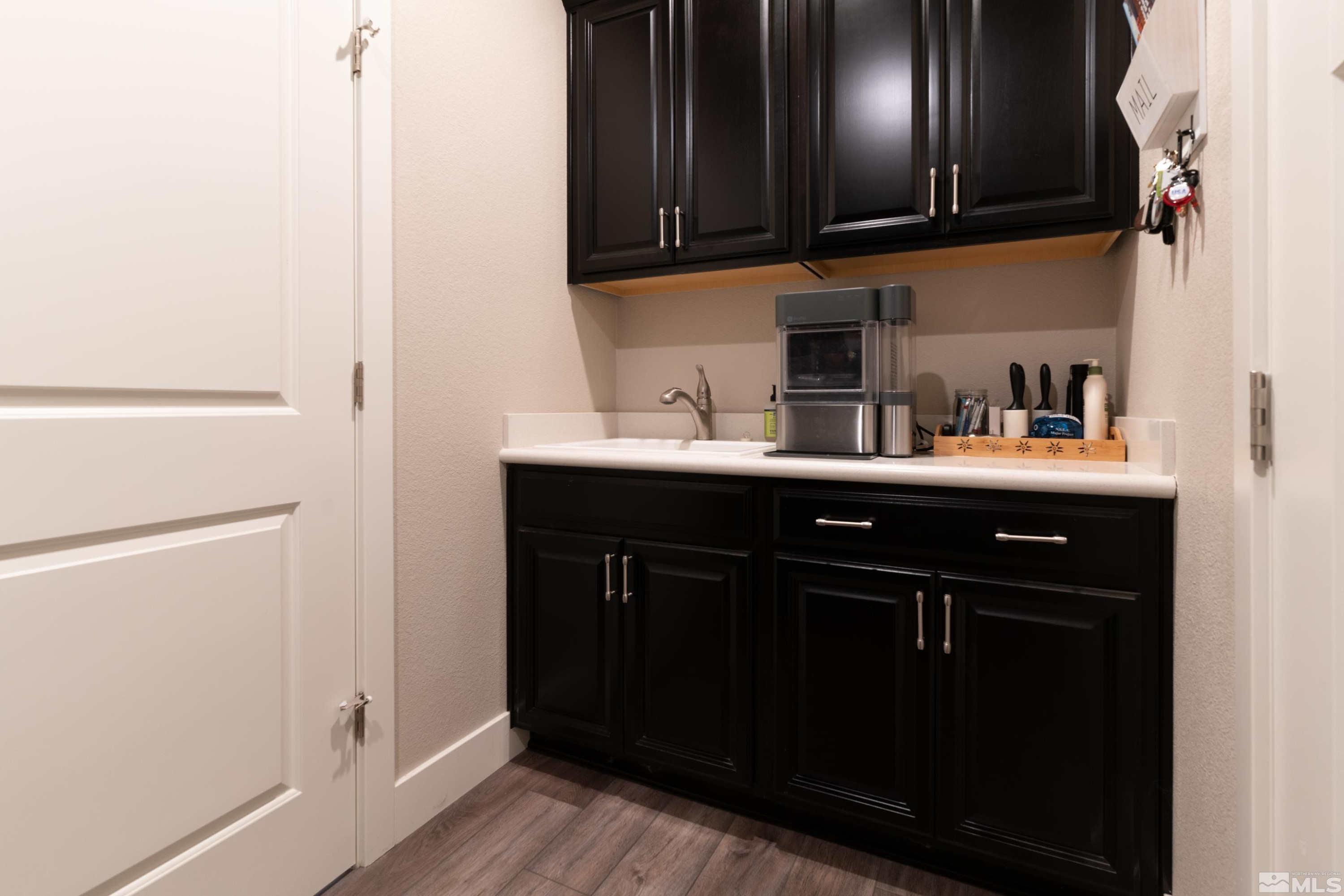 1230 West Cottage Loop Gardnerville, NV 89460 - Photo 20 of 25 a kitchen with a sink and cabinets