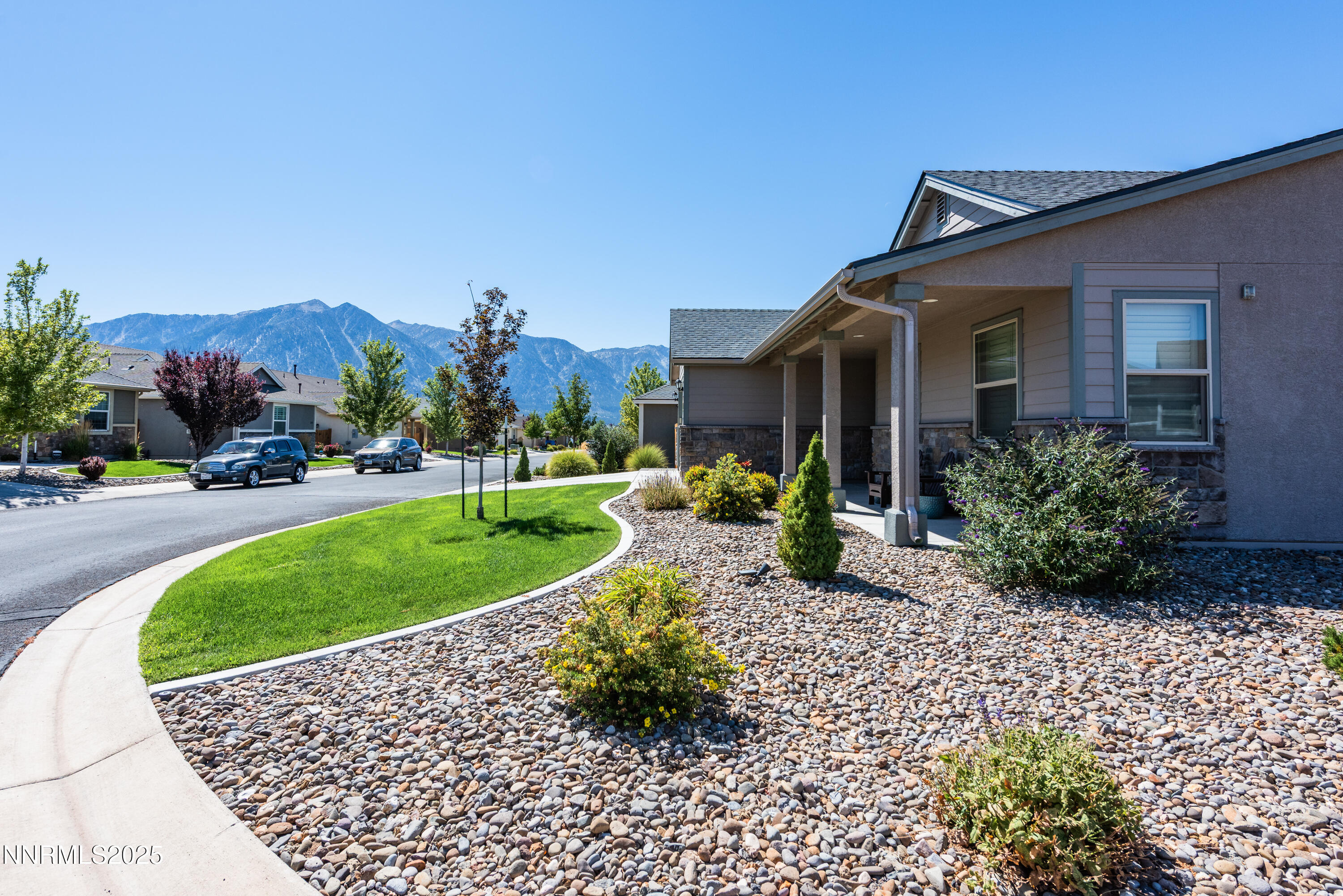 1230 West Cottage Loop Gardnerville, NV 89460 - Photo 2 of 25 a front view of a house with a yard