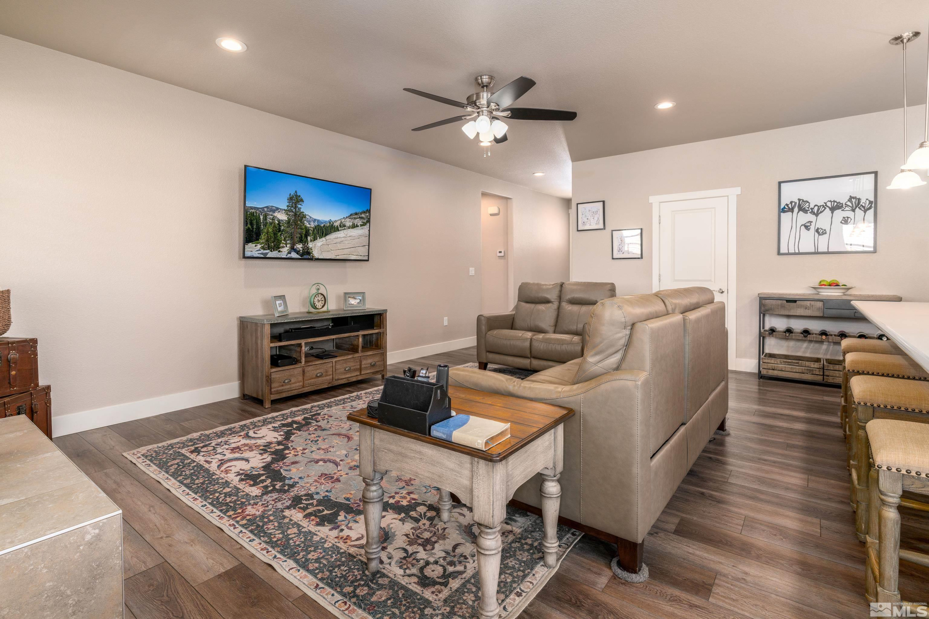 1230 West Cottage Loop Gardnerville, NV 89460 - Photo 3 of 25 a living room with furniture and a flat screen tv