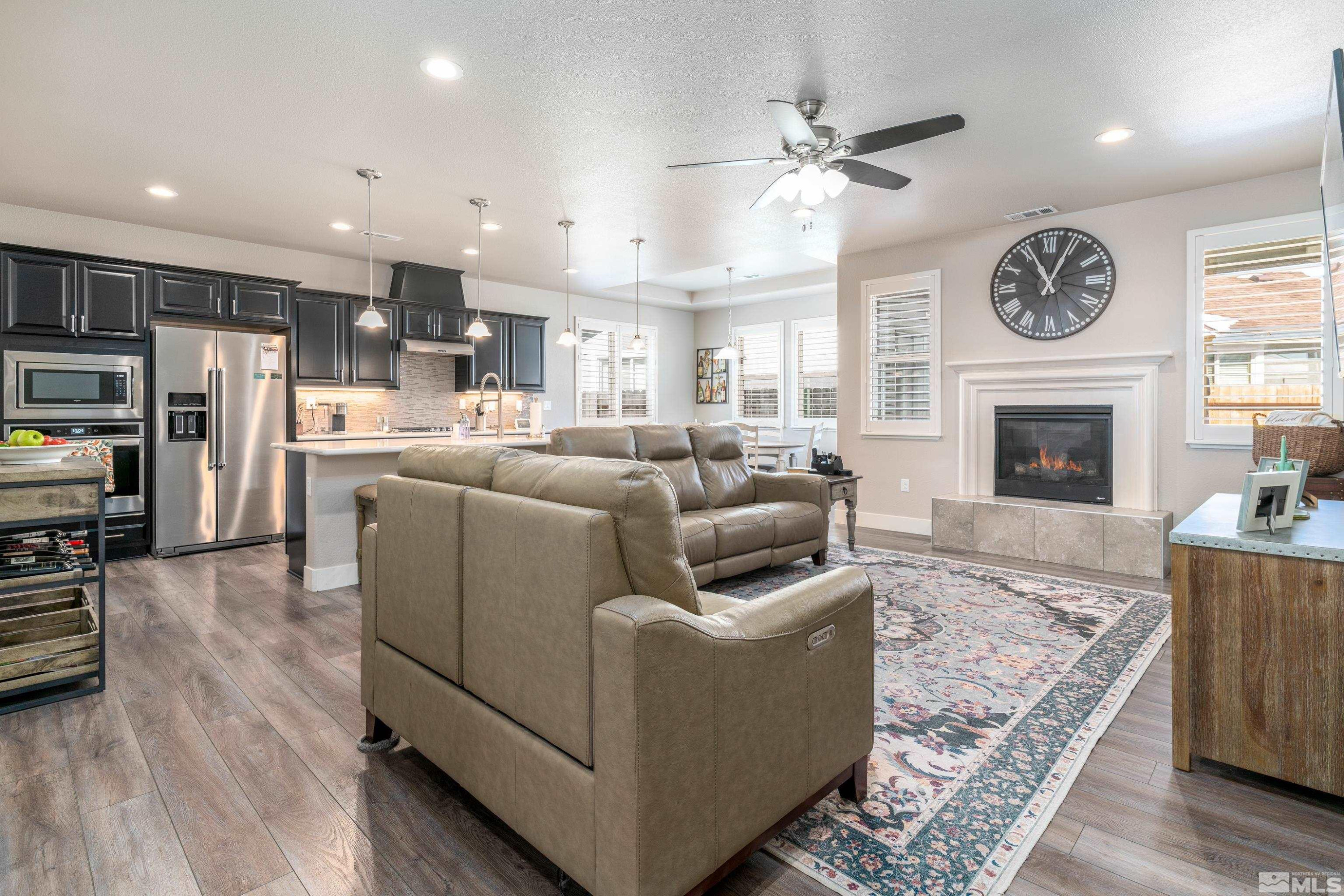 1230 West Cottage Loop Gardnerville, NV 89460 - Photo 5 of 25 a living room with furniture a fireplace and wooden floor