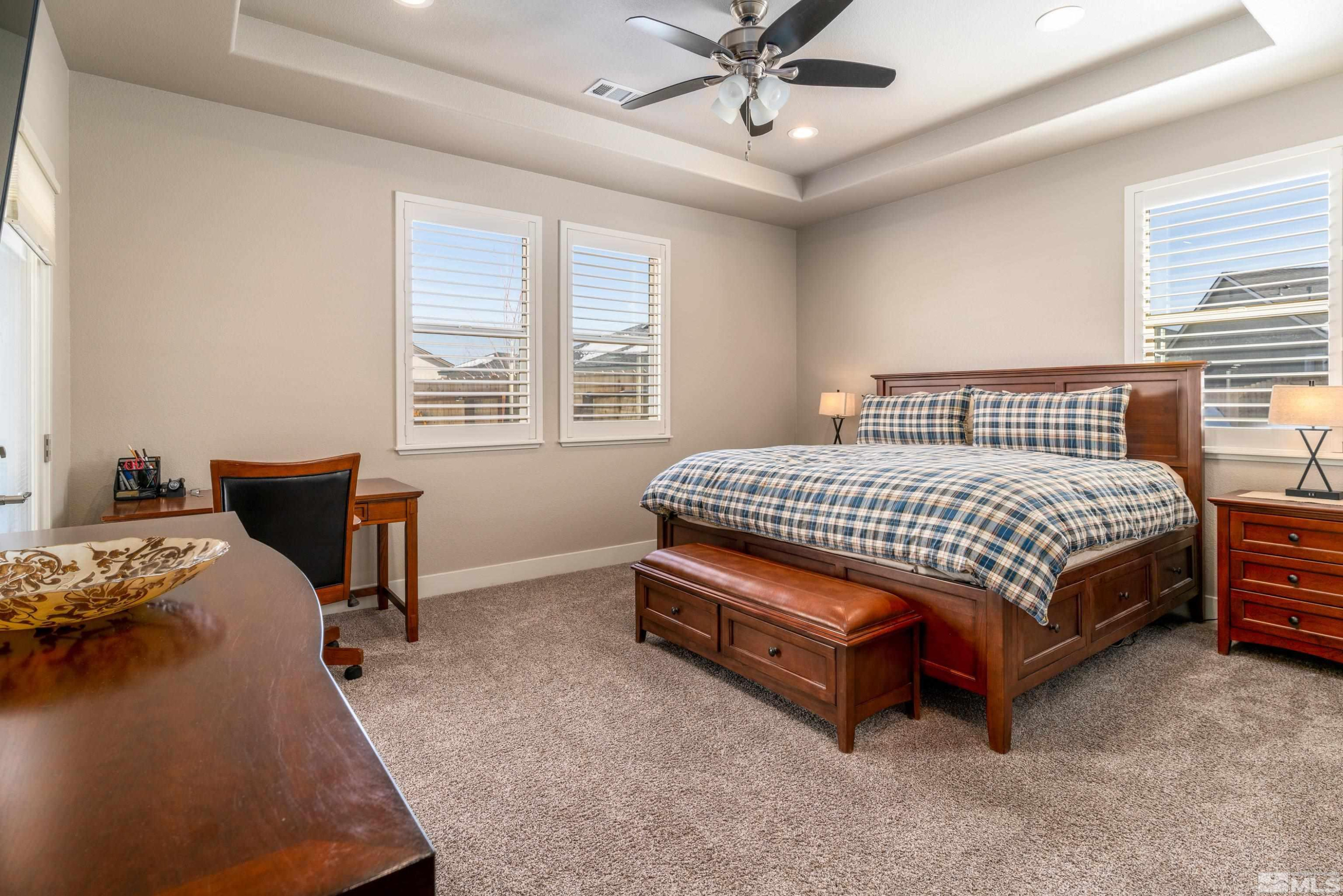 1230 West Cottage Loop Gardnerville, NV 89460 - Photo 10 of 25 a bedroom with a bed chair and window